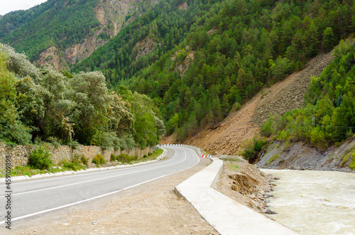 asphalt mountain road and river