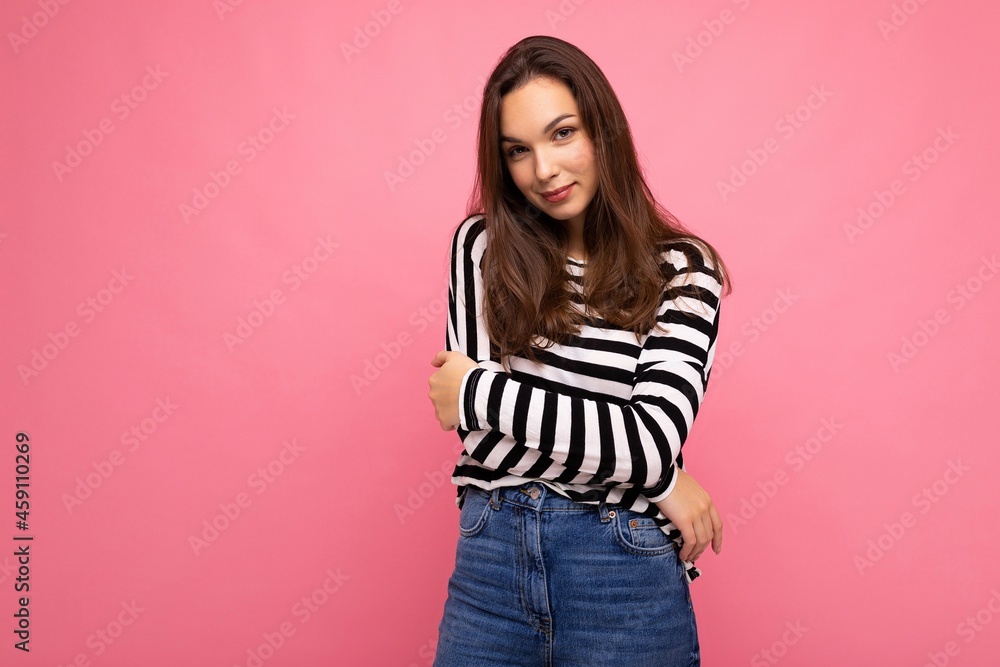 Portrait of positive cheerful fashionable woman in casual clothes isolated on pink background with copy space Portrait of positive cheerful fashionable woman in casual clothes isolated on pink background with copy space
