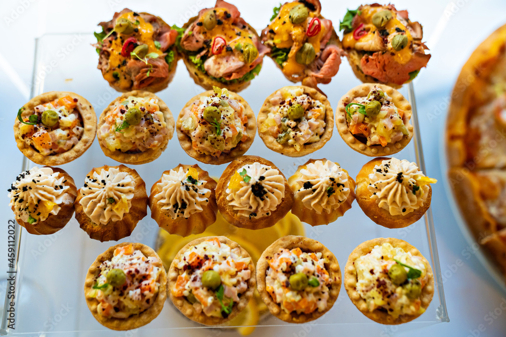 canapes, tartlets with pate and salad. delicious and simple snacks canapes, tartlets with pate and salad. delicious and simple snacks