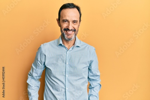 Middle age hispanic man wearing casual clothes with a happy and cool smile on face. lucky person. © Krakenimages.com