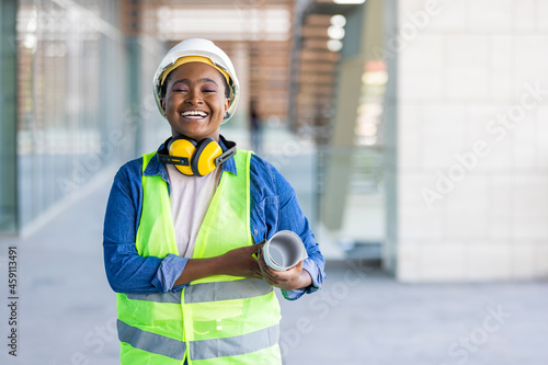 Фотография A female architect posing and looking at camera