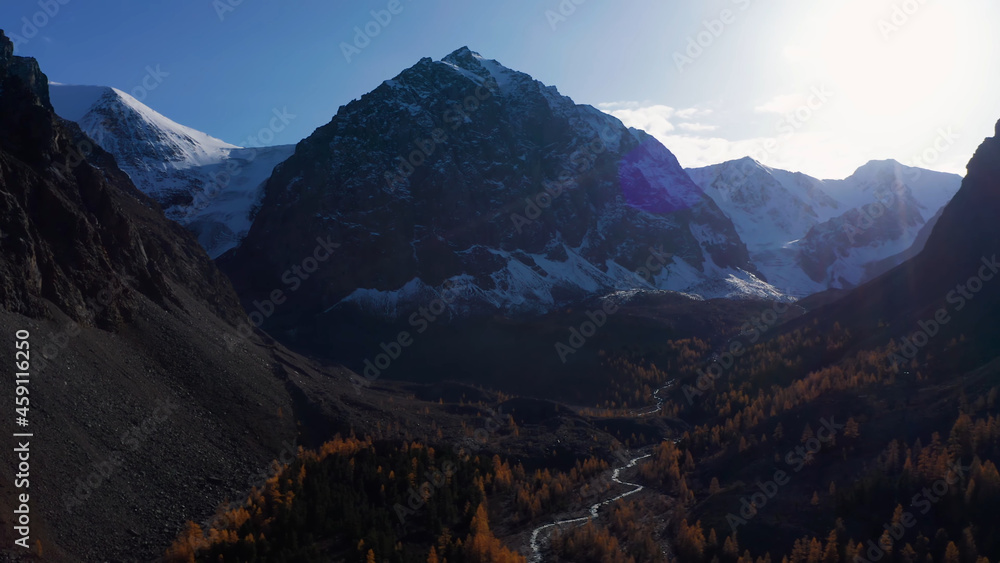 Rocky mountains at sunset, the river flows below