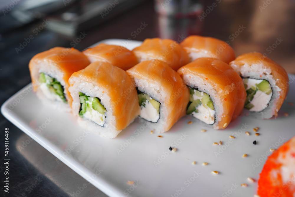 a set of Philadelphia rolls on a white plate. Japanese cuisine. a set of Philadelphia rolls on a white plate. Japanese cuisine.