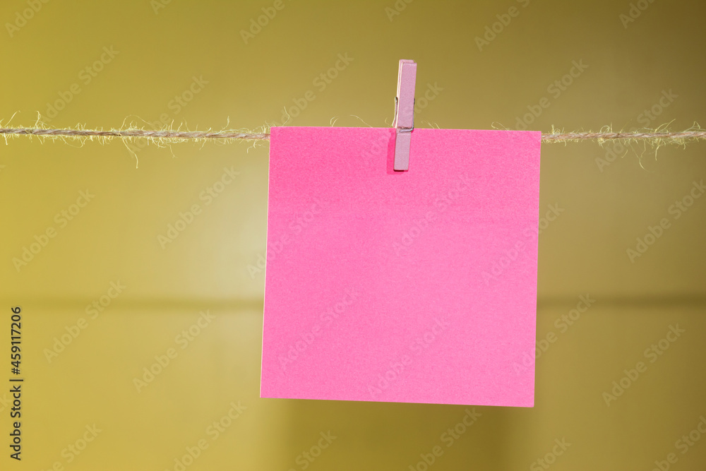 The paper for the text is suspended from a rope The paper for the text is suspended from a rope