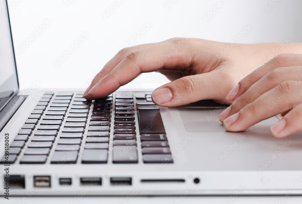 Man's hand typing on laptop keyboard. Man's hand typing on laptop keyboard.