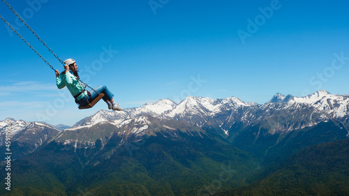 Flying on a mountain swing, entertainment in nature