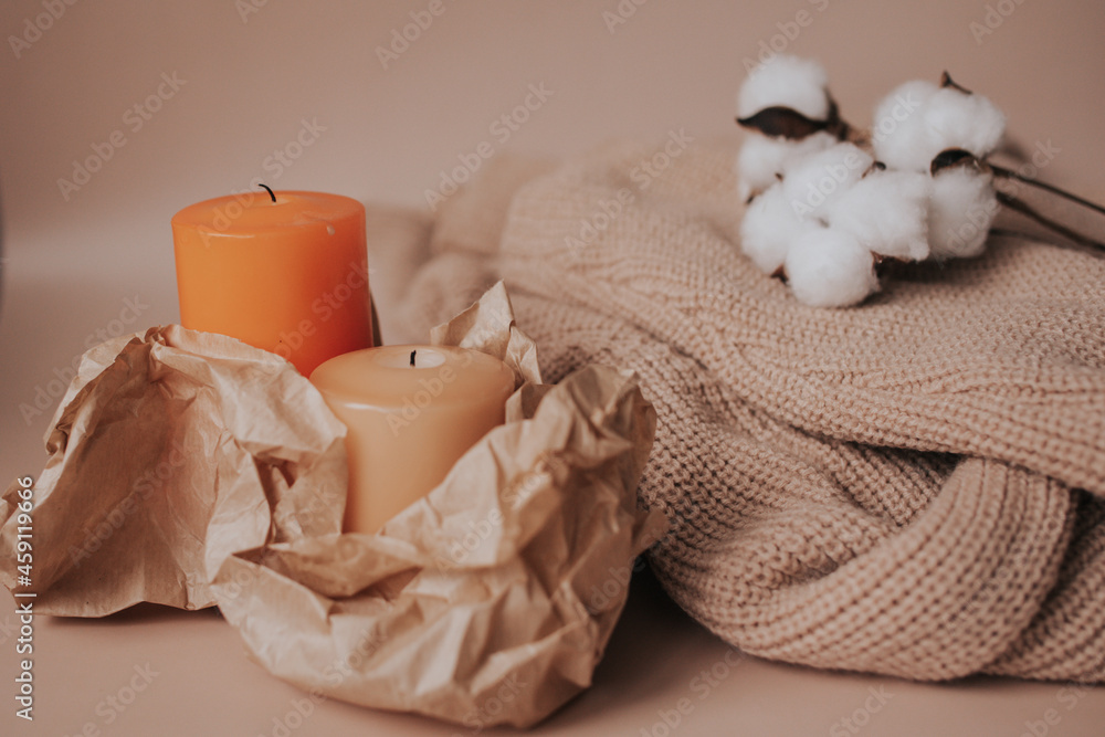 beige sweater and candle beige sweater and candle