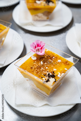 Catering. kremenki with fruit desserts decorated with flowers.  photo