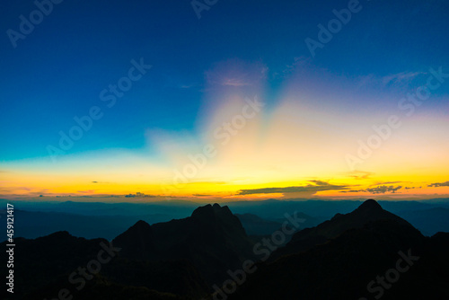 Sunset sky with cloud on top of mountain