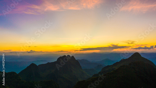 Silhouette sunnset on mountain peak sky with cloud