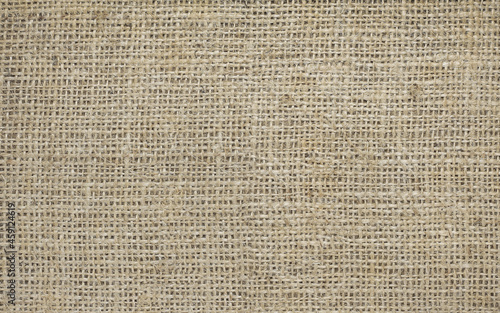 Brown burlap with beautiful canvas texture of brown fabric in retro style for placing advertising text or other inscription as vintage burlap background with burlap texture and beautiful burlap color