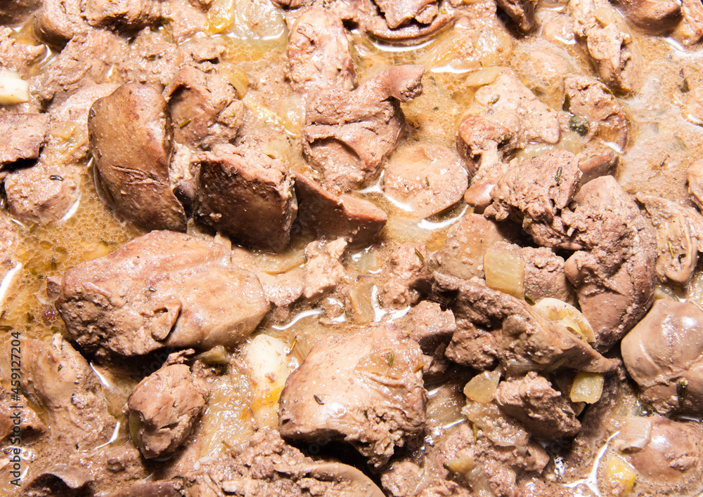 Finely chopped poultry fryied liver. Close-up texture.