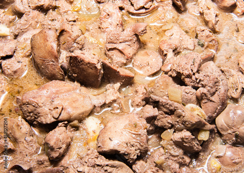 Finely chopped poultry fryied liver. Close-up texture. photo