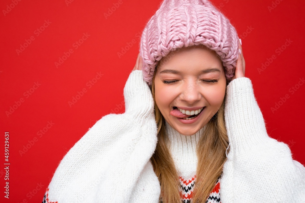 Closeup photo of beautiful happy funny amusing young blonde woman standing isolated over colourful background wall wearing everyday trendy clothes showing facial emotions Closeup photo of beautiful happy funny amusing young blonde woman standing isolated over colourful background wall wearing everyday trendy clothes showing facial emotions