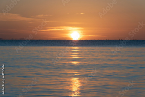 Beautiful vibrant late Summer sunset over Pentewan Sands on English Cornwall coast with long exposure motion blur of ocean © veneratio