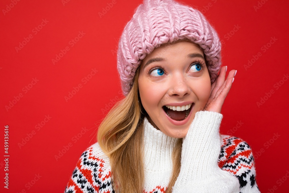 Closeup photo of beautiful happy surprised young blonde woman standing isolated over colourful background wall wearing everyday trendy clothes looking to the side showing facial emotions Closeup photo of beautiful happy surprised young blonde woman standing isolated over colourful background wall wearing everyday trendy clothes looking to the side showing facial emotions