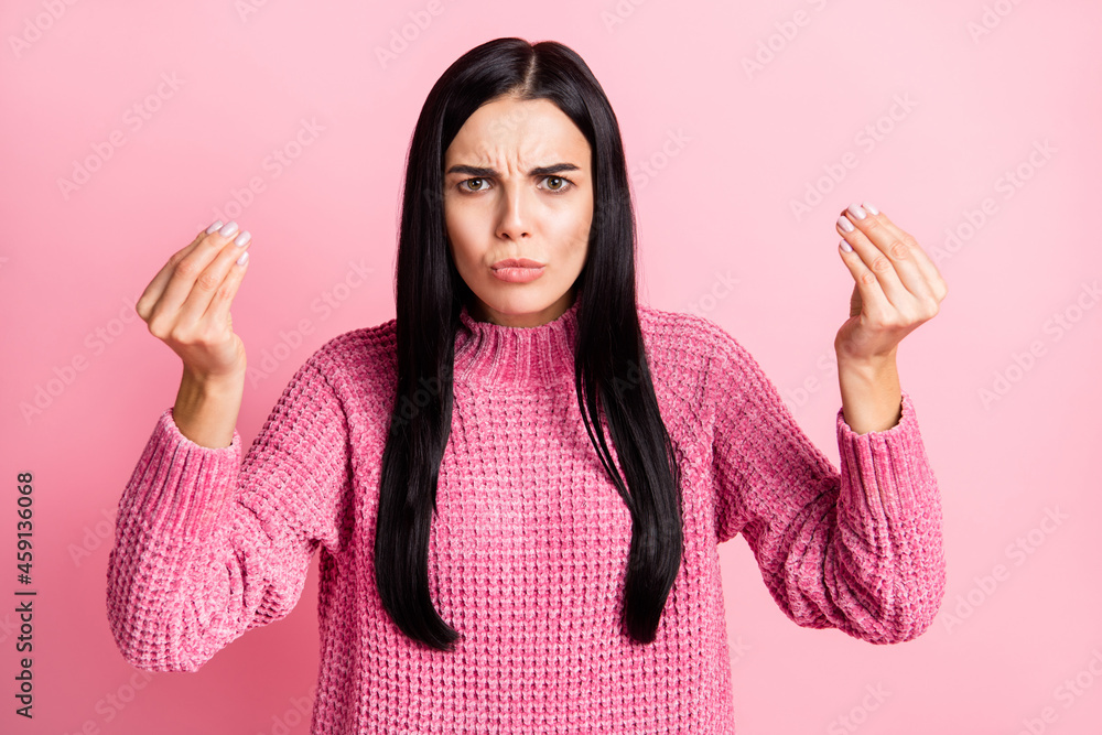 Photo portrait of unhappy girl showing italian hand gesture isolated on pastel pink colored background Photo portrait of unhappy girl showing italian hand gesture isolated on pastel pink colored background