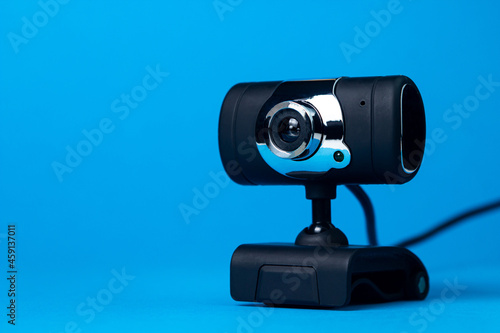 Webcam on a blue background. Remote communication. Modern technologies and methods of communication