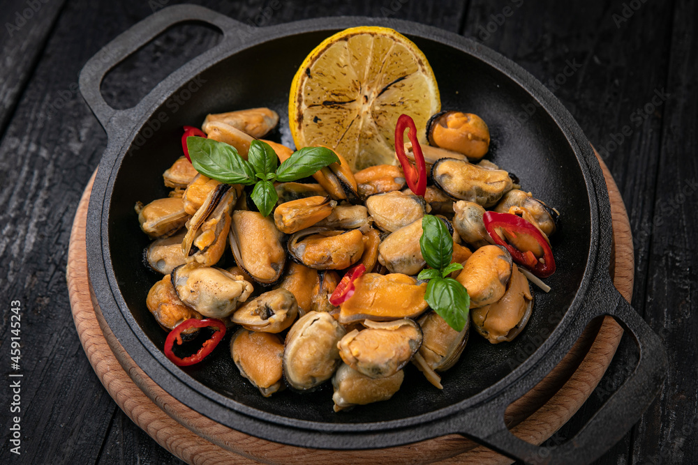 grilled seafood in a dark pan
grilled seafood in a dark pan