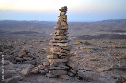 Canvas Print Cairn at sunrise, stones balances, pyramid of stones at sunset, concept of life balance, harmony and meditation