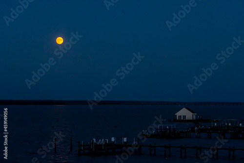 Harvest Moon Rises over the Northern Neck above the Rappahannock River in Tappahannock, Virginia part of the Middle Peninsula photo