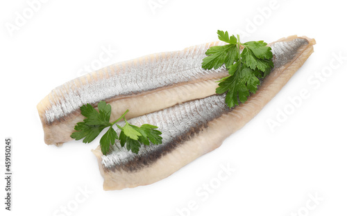 Delicious salted herring fillets with parsley on white background, top view