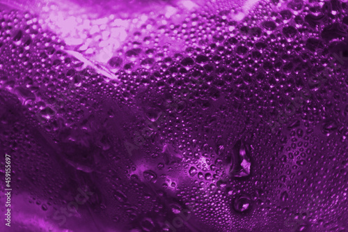 Purple abstract background from drops of water. Beautiful bright background.