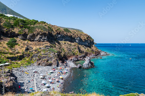 Fototapeta Naklejka Na Ścianę i Meble -  Salina island (Aeolian archipelago), Messina, Sicily, Italy, 08.17.2021: view of Scario beach in Malfa.