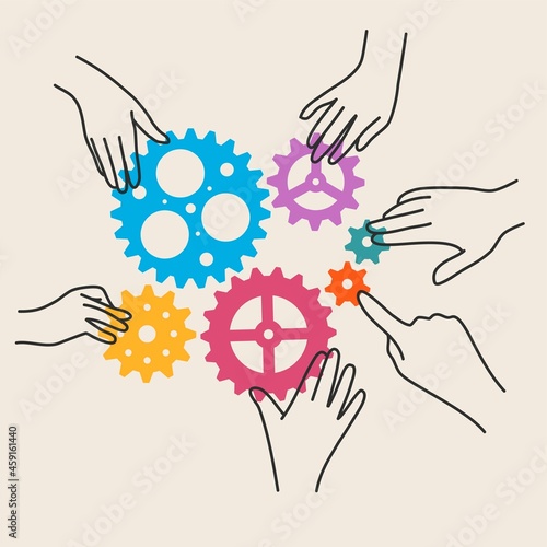 Hands of business men assemble gears into a puzzle in a single whole.