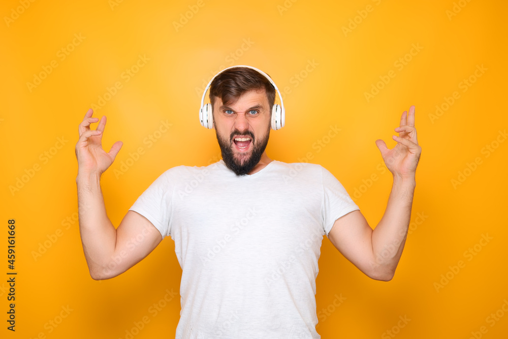 man shows teeth raised his hands up and listens to music man shows teeth raised his hands up and listens to music