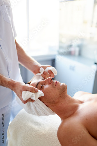 Close-up of neck massage with towel