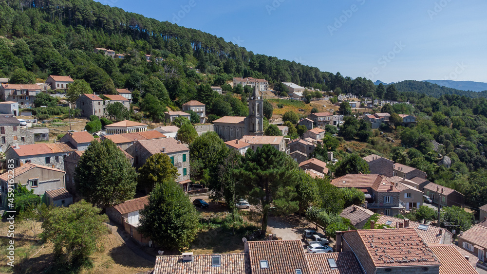 Aerial view of the mountainous village of Zonza in the South of Corsica, France, with the Parish church of the Assumption in the center