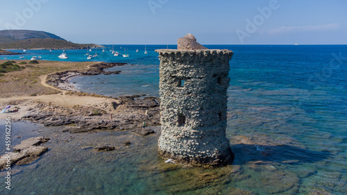 Aerial view of the Genoese tower Santa Maria di la Cappella on the Cap Corse in Upper Corsica, France - Remains of a medieval building half demolished and flooded by the Mediterranean Sea