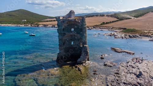 Aerial view of the Genoese tower Santa Maria di la Cappella on the Cap Corse in Upper Corsica, France - Remains of a medieval building half demolished and flooded by the Mediterranean Sea photo