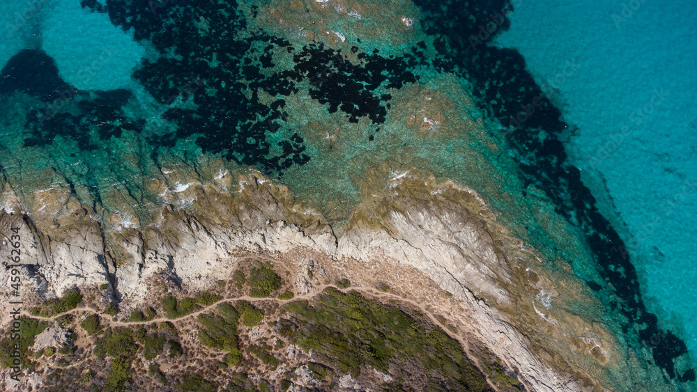 Aerial view of Saleccia Beach in the Agriates desert in Upper Corsica, France - Paradise beach in the Mediterranean Sea with tropical waters, only accessible by boat