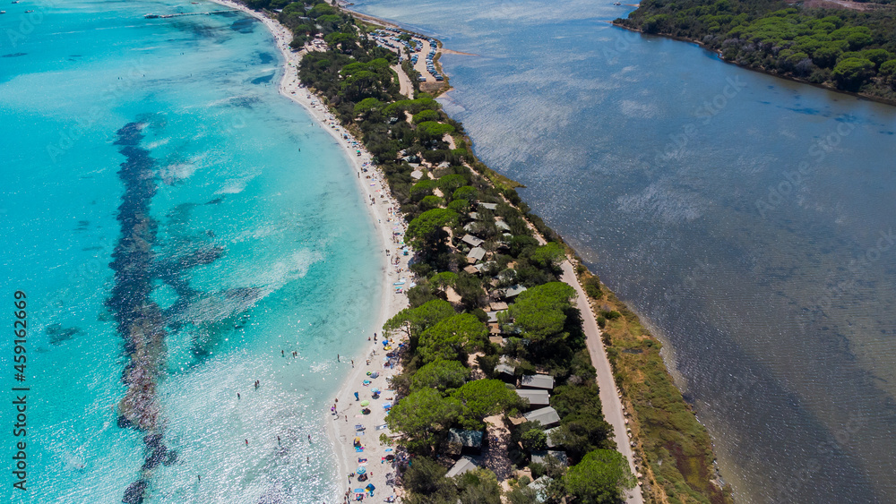 Aerial view of the sand strip between the beach and the pond of Santa Giulia in the South of Corsica, France - Separation between fresh and sea water of different colors