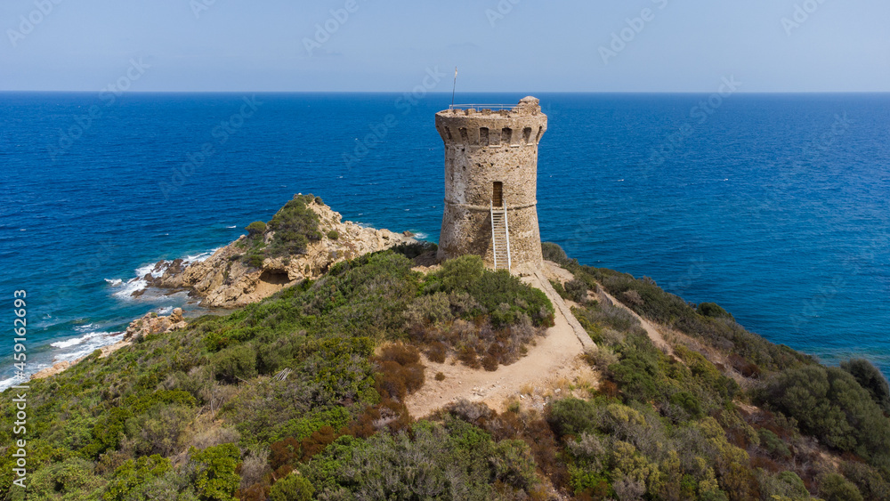 Aerial view of the ruins of the round Genoese tower of Fautéa in the South of Corsica, France - Remains of a medieval lookout overlooking the Mediterranean Sea