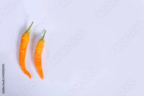 colored chilli on white background