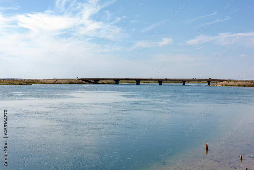 Henichesk Strait . View of the strait and the bridge connecting the two banks.