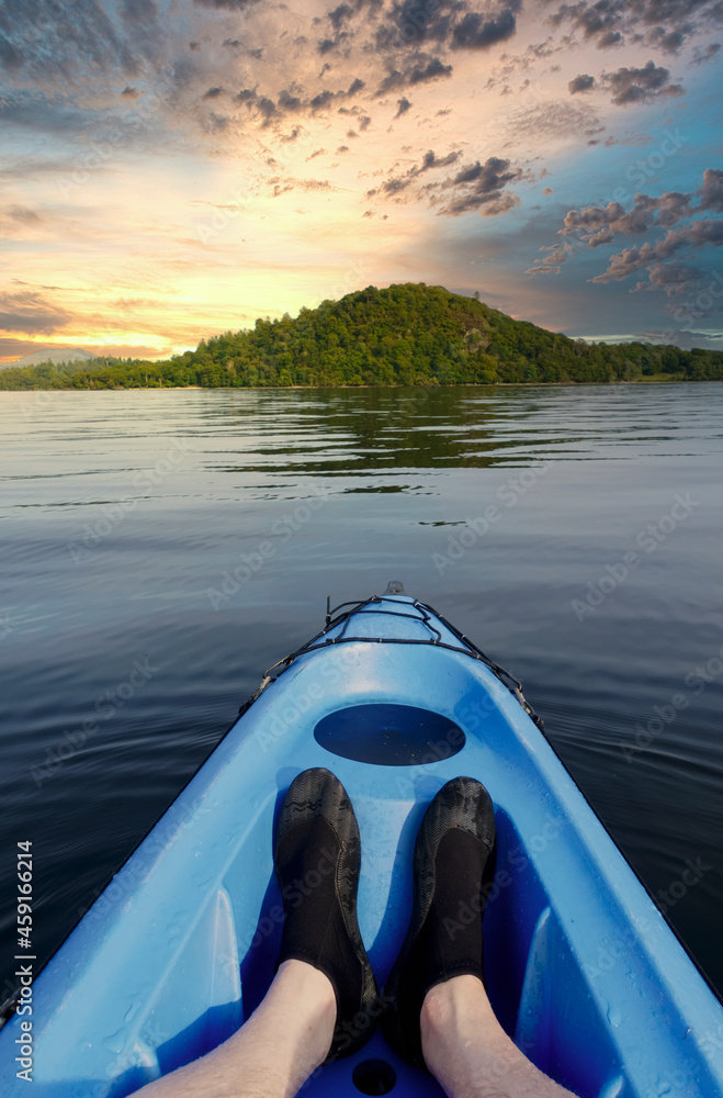 Blue kayak in Loch Lomond on open water Blue kayak in Loch Lomond on open water