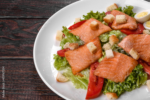 Delicious fresh salad with red fish for the festive table