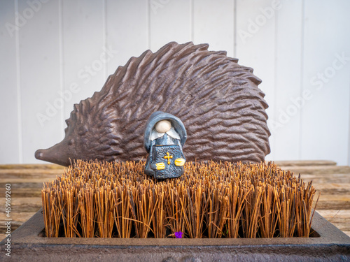 Wallpaper Mural Preacher Gnome in front of a Metal Hedgehog in the Garden Torontodigital.ca