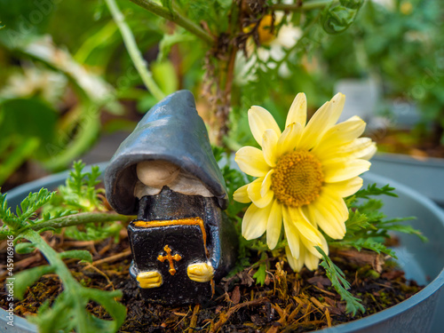 Wallpaper Mural Preacher Gnome in a Flower Pot with Yellow Flower Torontodigital.ca