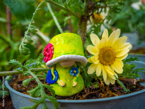 Wallpaper Mural Gnome Queen in a flower pot with yellow flower Torontodigital.ca