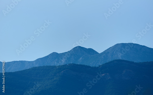 Fototapeta Naklejka Na Ścianę i Meble -  Blue mountain peaks against the blue sky in the morning