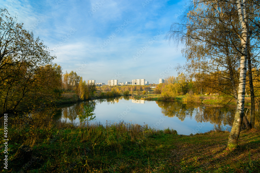 autumn city landscape with lake