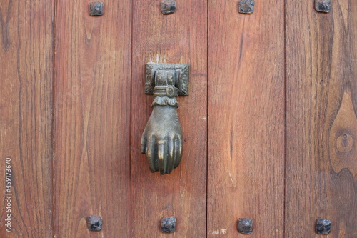 Vintage brass door knocker on an old door, Greece, Halkidiki, Arnaia
 photo