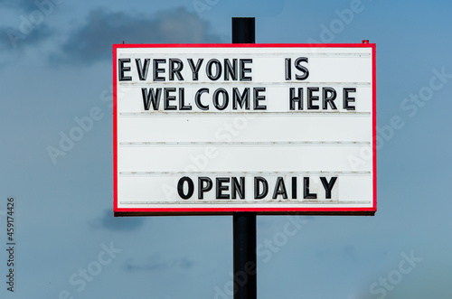 Exterior retail open sign during the pandemic restrictions illustrating equity. photo
