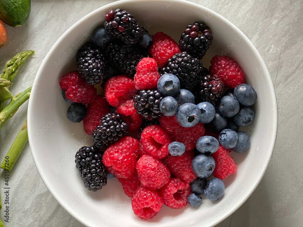 Home-cooked meal and preparations. Vegetables, Berries, and sauce. Home-cooked meal and preparations. Vegetables, Berries, and sauce.