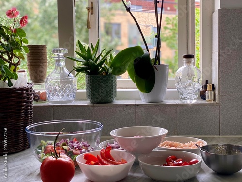 Home-cooked meal and preparations. Vegetables, Berries,  and sauce.